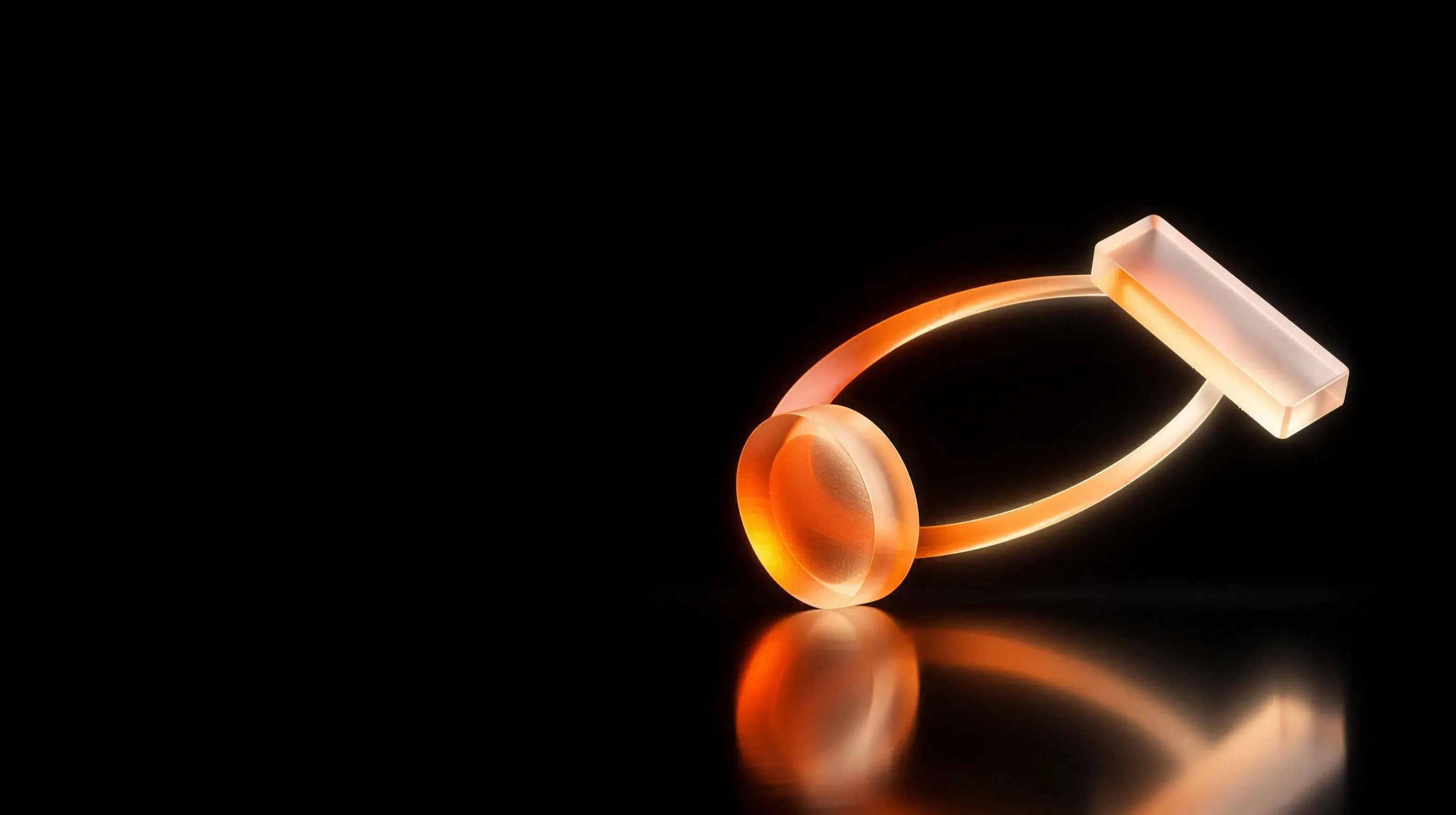 A glass coin and a glass bar exchanging places along a glowing arc